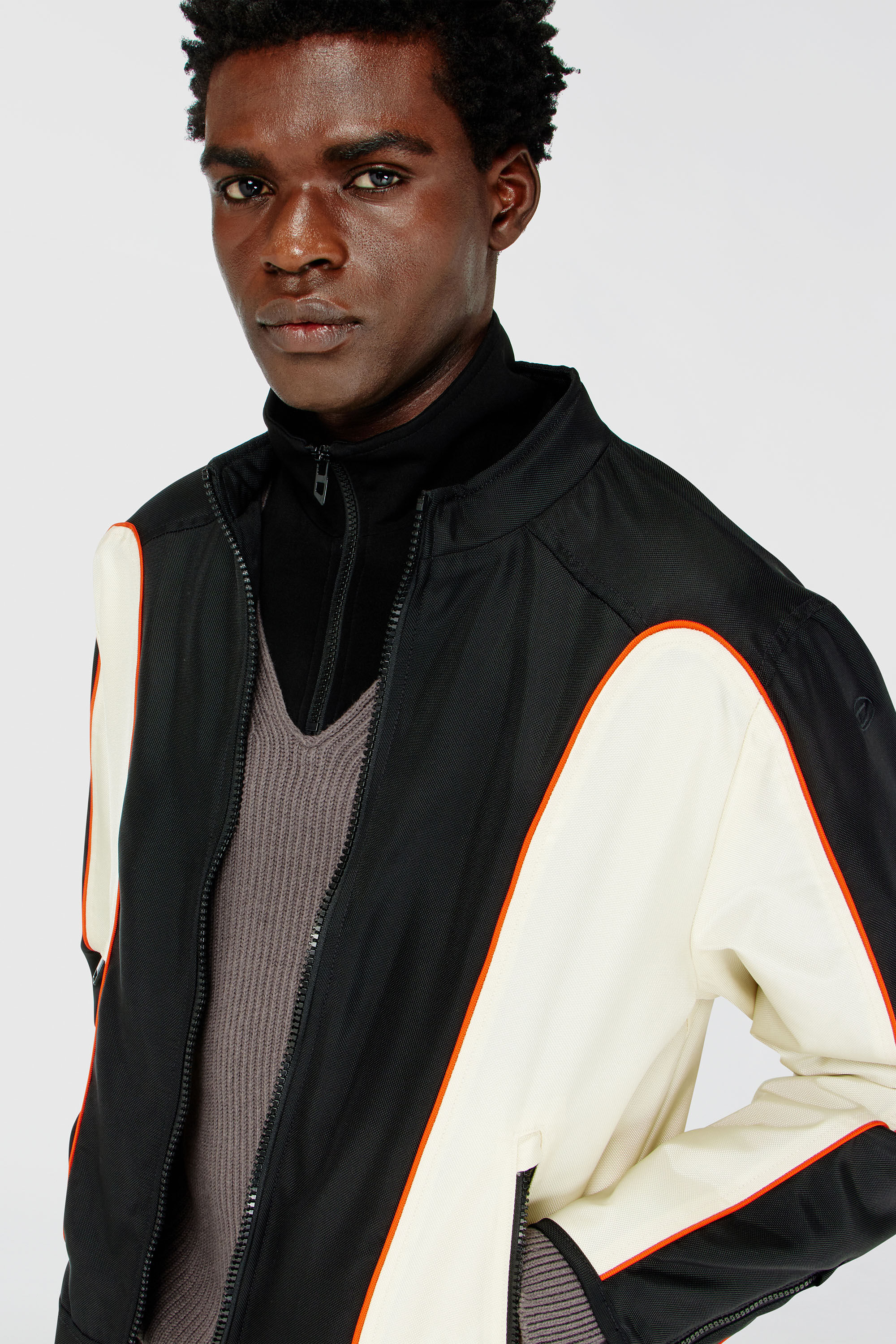 Men's Nylon jacket with color block and piping details