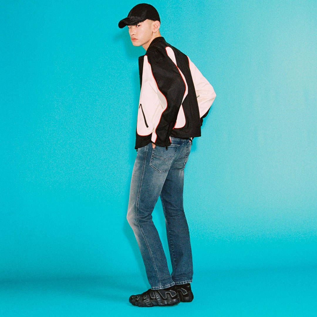 Shop men's new arrival denim  featuring a model showcasing a straight leg blue jean.